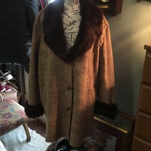 Leather coat. Imprinted design in taupes. Beautifully detailed toggle buttons.